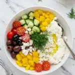 Greek cottage cheese bowl on a white marble countertop