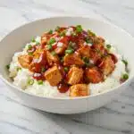 Close-up glamour shot of the finished cottage cheese BBQ chicken bowl