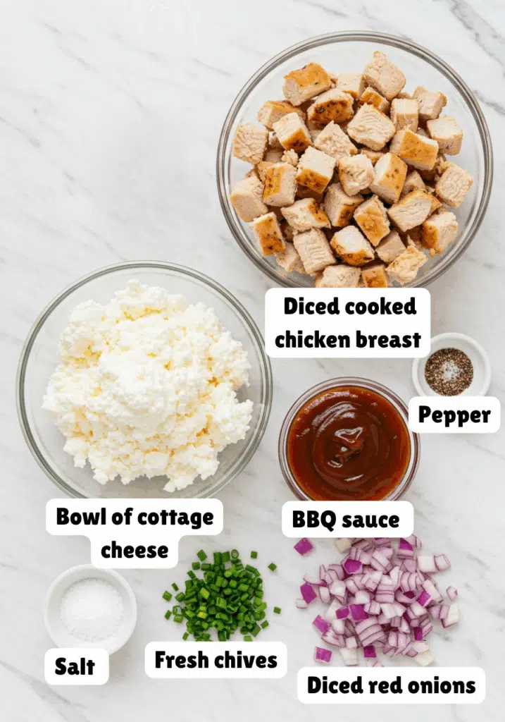 ingredient shot on white marble countertop showing all cottage cheese BBQ chicken bowl