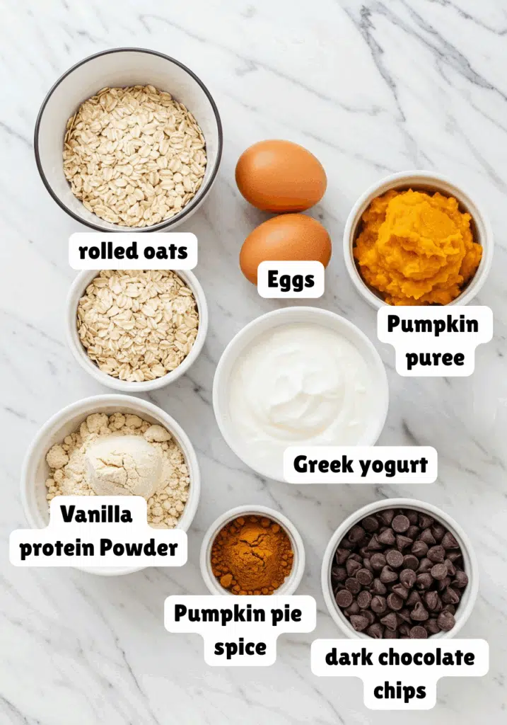 ingredients for high protein pumpkin muffins on a marble background